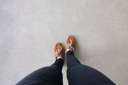 Close Up of Female Brown Shoes. Outdoor Fashion Shoes Footwear Concept Great For Any Use.の写真素材