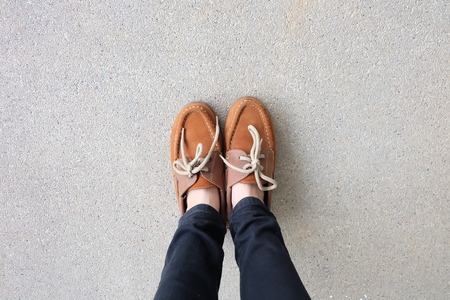 Close Up of Female Brown Shoes. Outdoor Fashion Shoes Footwear Concept Great For Any Use.の写真素材