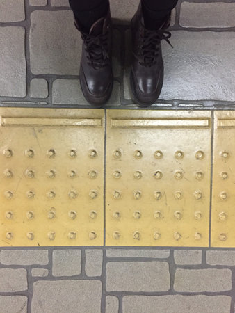 Top View of Brown Boots Shoes on Concrete Block Background Great For Any Use.