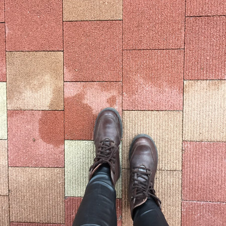 Top View of Brown Boots Shoes on Concrete Block Background Great For Any Use.の写真素材