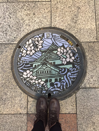 Female Feet in Boots Standing on Concrete Block Pavement with Round Great For Any Use.の写真素材