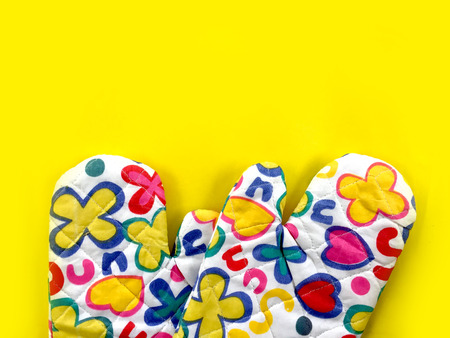 Colourful Flower Kitchen Oven Glove on Yellow Background Great For Any Use.の写真素材