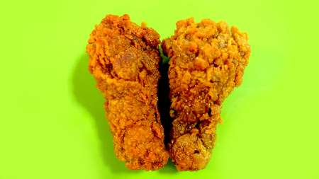 Crispy Fried Chicken in a Green Background Great For Any Use.の写真素材