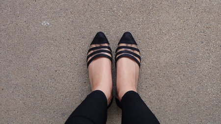 Close up of Stylish Female Black Shoes. Footwear on Floor Great For Any Use.の写真素材