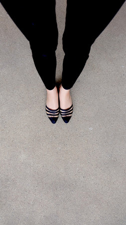 Close up of Stylish Female Black Shoes. Footwear on Floor Great For Any Use.