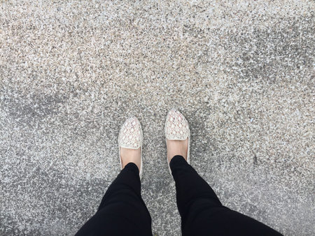 Close Up Of Girl's Feet Wearing Weave Sandals In The Ground Great For Any Use.