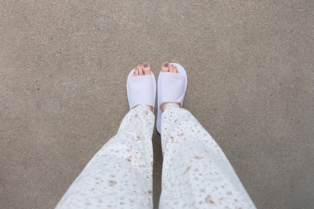 Selfie Feet Wearing White Slippers Indoor On The Ground Great For Any Use.の写真素材