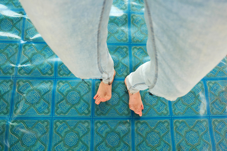 Woman's Bare Feet on Linoleum Background Great For Any Use.の写真素材