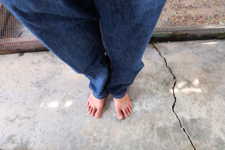 Male's Bare Feet on Concrete Background Great For Any Use.の写真素材