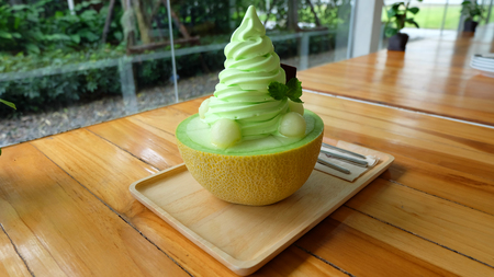 Close Up Ice Melon Bingsu, Korean Dessert Ice Cream Cantaloupe on Wooden Table Background Great For Any Use.の写真素材
