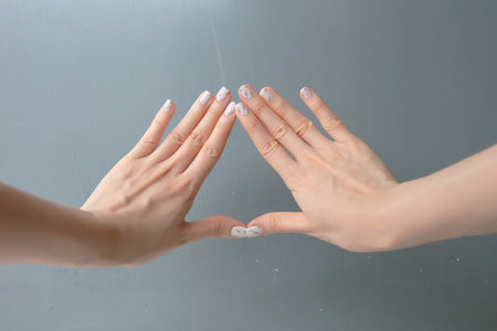 Beautiful Nail Polish, Manicure Nail. Close Up Granite Gray Nails on the Gray Background Great For...