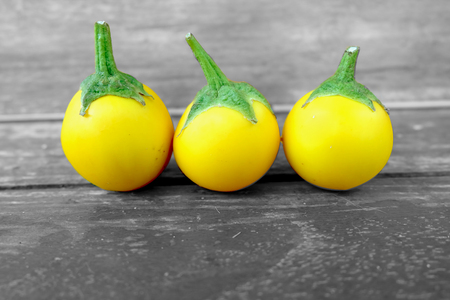 Yellow Eggplant. Fresh Yellow Eggplant Thai Vegetable on Old Wooden Table Great For Any Use.の写真素材