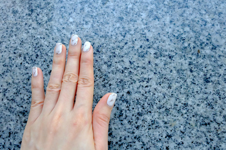 Hand and Nail Polish, Manicure Nail. Close Up Granite Gray Nails on Granite Background Great For Any Use.の写真素材