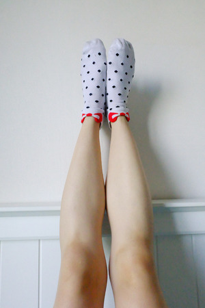 Polka Sock. Selfie Legs and Feet Wear White Socks with Polka Dot Background Great For Any Use.の写真素材