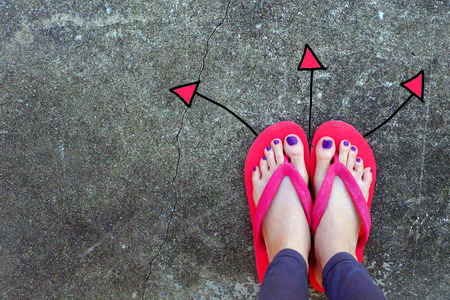 Violet Nail Pedicure. Womanâs Sandals Feet with Arrows Drawn Choices Direction on Cement Background Great for Any Use.の写真素材