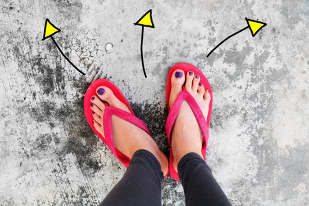 Violet Nail Pedicure. Womanâs Sandals Feet with Arrows Drawn Choices Direction on Cement Background Great for Any Use.の写真素材