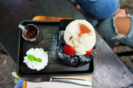 Charcoal Bread Buttered Toast, Honey Toast with Vanilla Ice Cream, Strawberry and Whipped Cream Dessert on Wooden Salver Background Great for Any Use.の写真素材