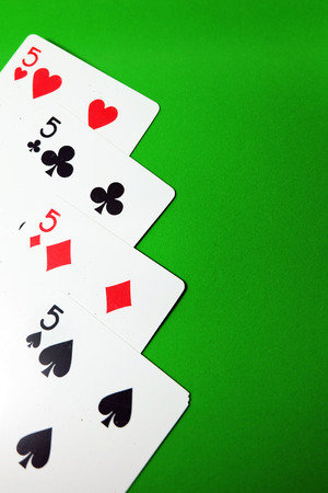 5 Playing Card Game. Old Five of Heart, Spades and Diamonds Playing Cards Isolated On Green Background Great for Any Use.の写真素材
