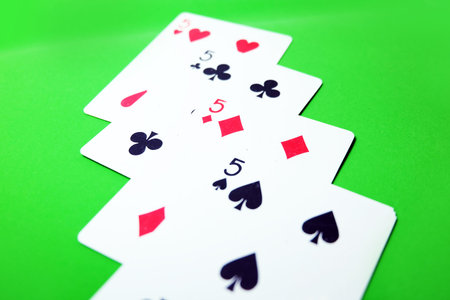 5 Playing Card Game. Old Five of Heart, Spades and Diamonds Playing Cards Isolated On Green...