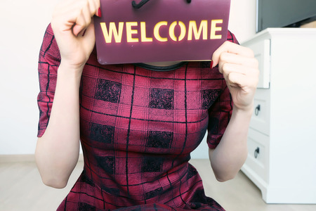 Welcome Letters. Woman Hand Holding with The Words Welcome Isolated in the White Room Background Great for Any Use.の写真素材