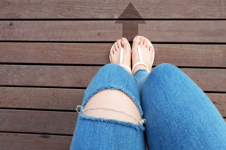Selfie Lack of Jeans and Shoes on the Road. Sandal with Arrow Ahead on Wooden Floor Background Great for Any Use.の写真素材