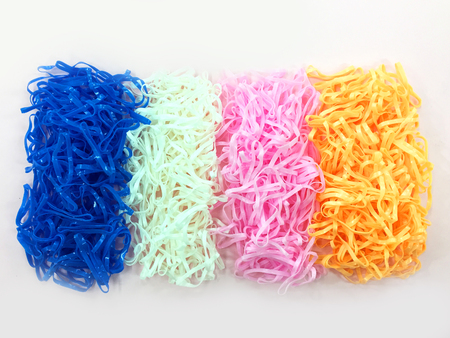Plastic Rubber Bands. Colorful Pile of Rubber Band Isolated on Pink Background Great for Any Use.の写真素材
