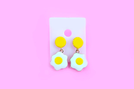 Fried Egg Earring Fashion Accessories. Beautiful Egg Earrings Isolated on Pink Background Great For...