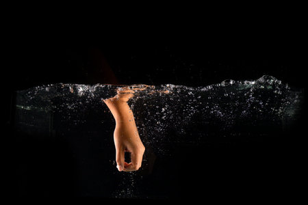 Man is Hand and Water Splash in Anger Isolated, Concept Fist Punching. Male Fight Hand in Water...