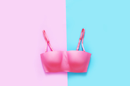 Beautiful Pink Underwear Isolated on Pink and Blue Color Pastel for Valentine is Day. Set of Accessory Lingerie Fabric, Copy Space. Women is Lace Sexy Bra (Brassiere) on Two Tone Background, Top View.の写真素材