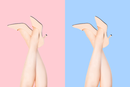 Beautiful Caucasian Woman Sexy Legs Wearing Beige Medium High-Heels Shoes. Fashion Accessory Shoe Selfie. Female Wear Nude Sandals Raised Isolated Over Pink and Blue Color Studio Background Top View.の写真素材
