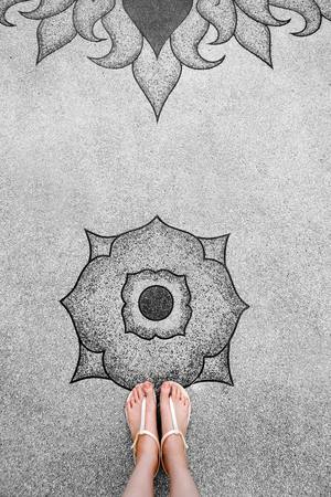 Selfie Young Woman of Feet in Fashion Shoes on Concrete Floor. Beautiful Girl Standing is Foot & Slim Legs Seen from Above on Road Street. Flat Shoe (Sandal) on Cement Layoknok Background, Top View.の写真素材