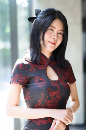 Asian woman wearing traditional cheongsam dress. Portrait of female model. Happy Chinese New Year.の写真素材