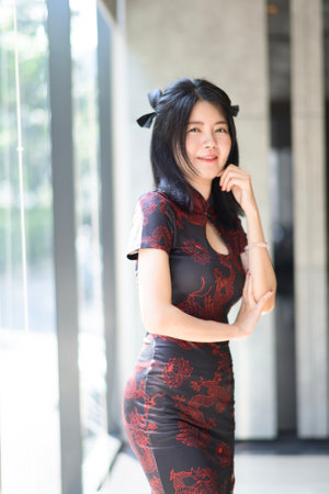 Asian woman wearing traditional cheongsam dress. Portrait of female model. Happy Chinese New Year.の写真素材