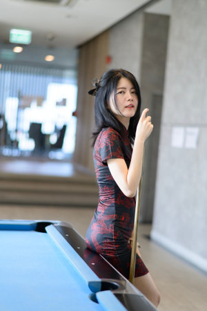 Asian woman wearing traditional cheongsam dress. Portrait of female model.の写真素材