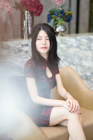 Asian woman wearing traditional cheongsam dress. Portrait of female model. Happy Chinese New Year.の写真素材