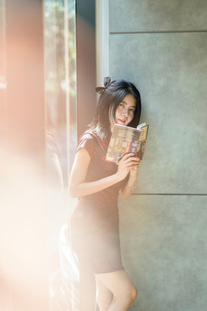 Asian woman wearing traditional cheongsam dress. Portrait of female model.の写真素材