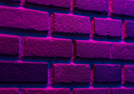 Brick wall in purple tone. Abstract background and texture for design.の素材