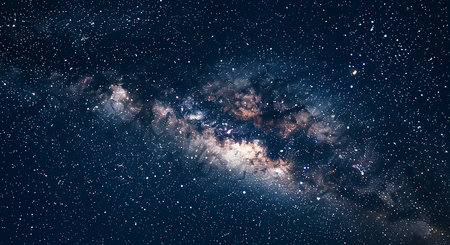 A breathtaking view of the Milky Way galaxy, showcasing its vibrant colors, swirling dust lanes, and countless stars in a cosmic dance of light and shadow.の素材