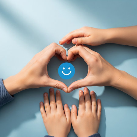 A group of hands, both adult and child, come together to create a heart shape, embracing a bright blue smiley face icon at its center.の素材