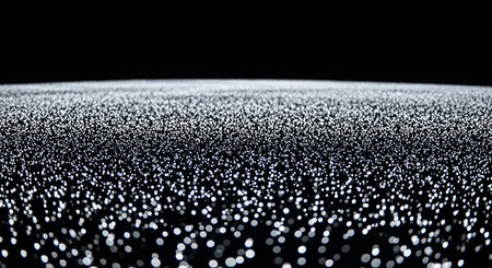 A mesmerizing abstract background featuring a field of countless tiny shimmering white dots against a solid black backdrop creating a sense of infinite digital space.の素材