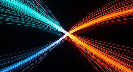 Vibrant blue and orange light streaks converge and cross in a dynamic, abstract composition against a deep black background, creating a sense of energy and connection.の素材