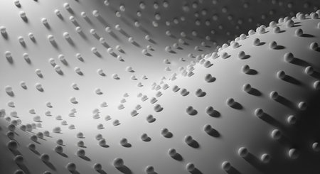 Close-up of a textured surface with numerous small, rounded dimples, creating a pattern of light and shadow.の素材