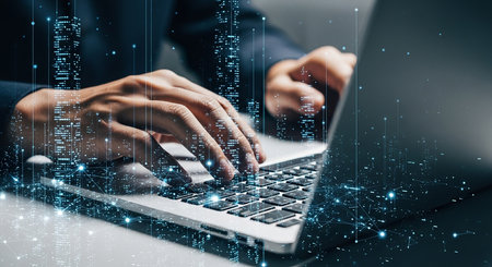 Close up of a professional man in a suit working on a computer. Abstract glowing binary code and data streams represent concepts of programming, cybersecurity, and modern technology.の素材