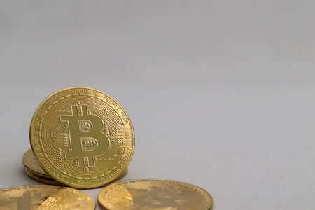 a pile of bitcoin over gray background. Cryptocurrency trading conceptの写真素材