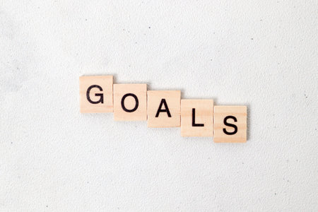 Top view of Goals word on wooden cube letter block on white background. Business conceptの写真素材
