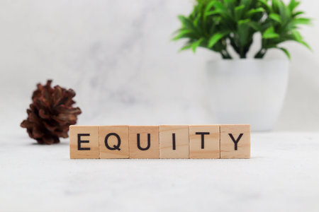 Top view of Equity word on wooden cube letter block on white background. Business concept