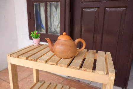 Clay teapot on the terrace. Traditional way of enjoying tea.の写真素材