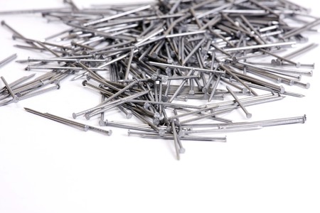 a couple of nails isolated on white backgroundの写真素材