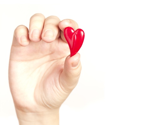 Hand holding the heart isolated on white backgroundの写真素材