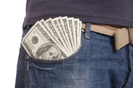 human hand is putting money in the pocketの写真素材